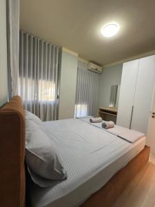 Postel nebo postele na pokoji v ubytování Majo Apartments
