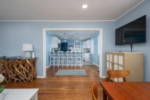 a living room with a kitchen and a dining room at Cozy 3-Bedroom Retreat in Charming Beaufort, SC in Beaufort