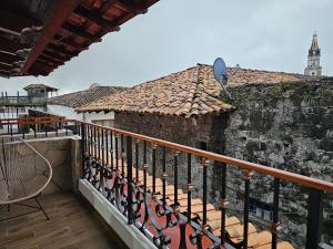 a balcony with a fence and a building at Posada Brisas Cuetzalan in Cuetzalán del Progreso
