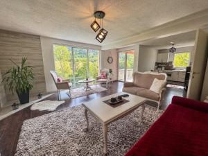 a living room with a couch and a table at Rest House in Olovo
