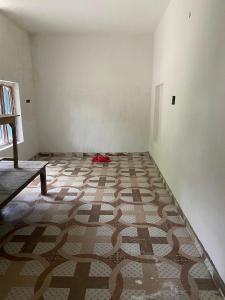 an empty room with a carpet on the floor at Himanshu in Jalālpur Dhai