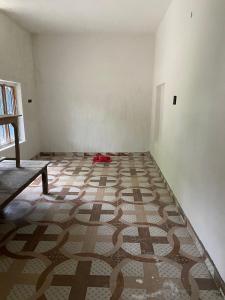 an empty room with a carpet on the floor at Himanshu in Jalālpur Dhai