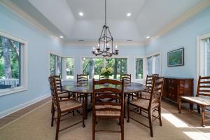 a dining room with a table and chairs at 2386 Golf Oak Park in Seabrook Island
