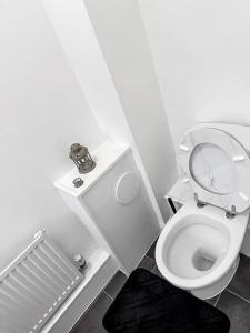 a small bathroom with a toilet with the lid up at 3BR with Ensuite & Downstairs WC in Litherland