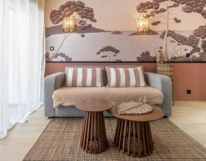 a living room with a couch and a table at Host Inn Sweet Croisette in Cannes