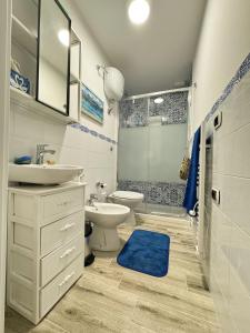 a bathroom with a sink and a toilet and a shower at Casa Vacanze Podere Radici in Velletri +4 photos