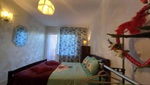a bedroom with a bed and a window at Ventspils Juras in Ventspils