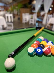 a group of billiard balls on a pool table at Chris Espace in Toliara