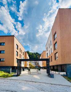 a building with a gate in front of it at Triple Shine Apartment Bjelašnica in Bjelašnica