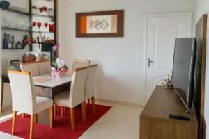 a dining room with a table and chairs at COP30 Apartment In The Center in Belém +4 photos