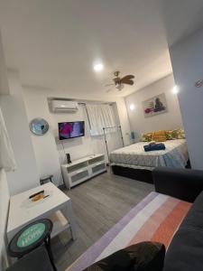 Ένα ή περισσότερα κρεβάτια σε δωμάτιο στο LOFTS ARENAL