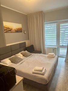 Katil atau katil-katil dalam bilik di Apartament Hanka 13 w Dominikana Family Resort Spa