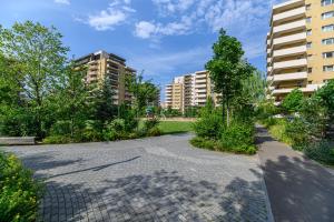 an empty street in a city with tall buildings at B-Holiday Luxury Apartments Urban Plaza in Braşov