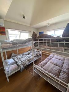 a room with three bunk beds in it at Ashigarashimogun - House - Vacation STAY 19326 in Mongawa