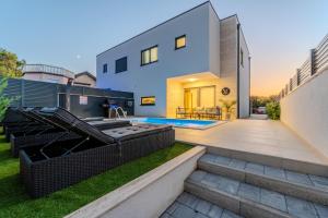 a house with a backyard with a swimming pool at New - Luxury Villa Angel - private pool in Vir