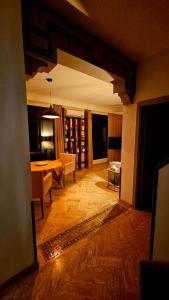 a living room with a table and a dining room at Dar Hegoa Villa Soleil et Chaleureuse in Marrakech +27 photos