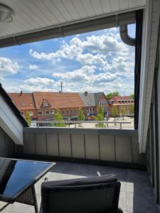 a view of a balcony with a table and chairs at Moderne Wohnung am Marktplatz in Sögel