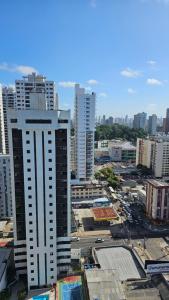 a view of a city with tall buildings at Quarto no apartamento do Edifício Ilha de Maui in Belém