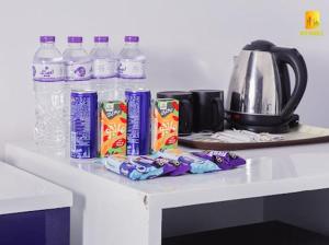 a counter with bottles of water and snacks on it at Istanbul HOTEL Minya in Minya
