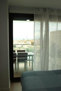 a room with a window with a table and a dining room at Casa Sueno Dream in Playa Honda