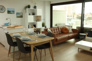 a kitchen and living room with a table and a couch at Casa Sueno Dream in Playa Honda