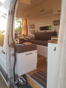 an interior view of a kitchen in a tiny caravan at Cozy Campervan Albania in Tirana