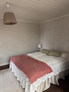 a bedroom with a large bed in a room at Cottage with lake property & own beach in Rättvik