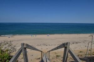 a view of a beach with the ocean in the background at Walk to Oceanside Beach in Wellfleet