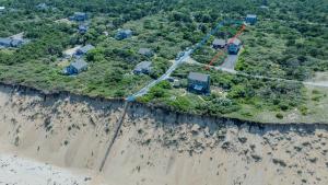 an aerial view of a house on a cliff at Walk to Oceanside Beach in Wellfleet