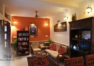 a living room with a couch and a table at Diya Bed and Breakfast in New Delhi