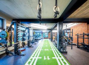 a gym with several treadmills and tread machines at Hotel Break Hradec Králové in Hradec Králové
