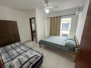 a bedroom with two beds and a window at Residencial Brasil Coroa - Staybeach in Porto Seguro +125 photos