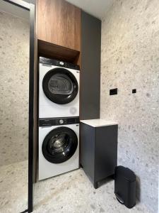 a laundry room with a washer and dryer at Villa Matea pool house in Zadar