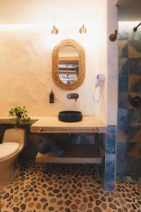 a bathroom with a sink and a toilet and a mirror at Mediterranean Apartment, CB510 in Estación El Salto