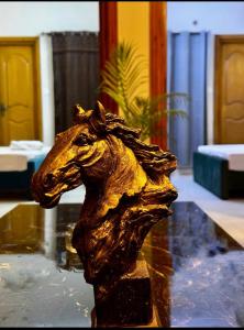 a statue of a horse head on a pool of water at Luxurious 2 Bed Apartment in Islamabad +14 photos