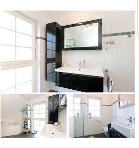 a bathroom with a sink and a mirror at Charming, cozy house near Munich in Ismaning