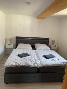 a bedroom with a bed with two towels on it at Ferienwohnung Holtensen in Göttingen