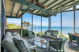 a living room with a view of the ocean at Surfers Paradise in Santa Barbara