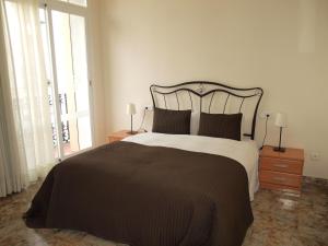 Llit o llits en una habitació de Hostal Portofino