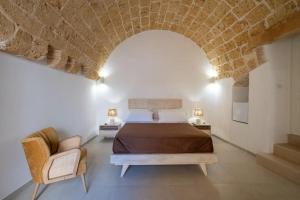 Ένα ή περισσότερα κρεβάτια σε δωμάτιο στο Le Antiche Dimore