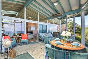 an outdoor patio with a table and chairs at Surfers Paradise in Santa Barbara