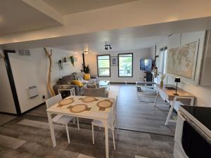 a living room with a table and a couch at The Hilltop in Whitehorse