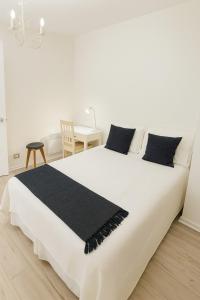 En eller flere senge i et værelse på Las Condes familiar Deluxe