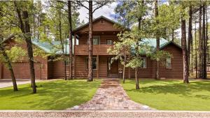 a wooden house with a pathway in front of a yard at Summer Special-Pinetop Cabin-Great 4 Family in Pinetop-Lakeside