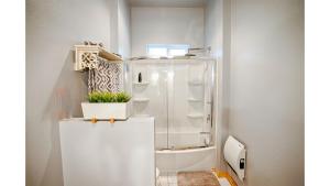 a white bathroom with a shower and a toilet at Summer Special-Pinetop Cabin-Great 4 Family in Pinetop-Lakeside +61 photos