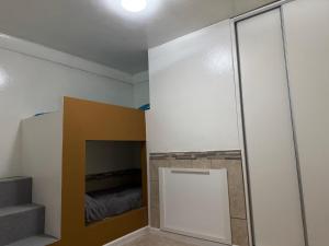 a room with a sliding glass door and a bed at Alquiler por Dia Alca!!!! in Viedma