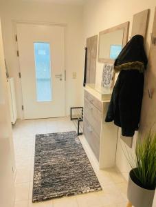 a living room with a door and a rug at Ferienhaus Dresdener Ausblick in Dresden +30 photos