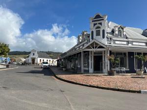 a building on a street in a small town at Platform 132 - 2 On Tabak with onsite Parking in Paarl