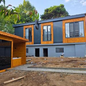 a house under construction with the front of it at Uludag Zirve Garden - BBQ Jacuzzi 