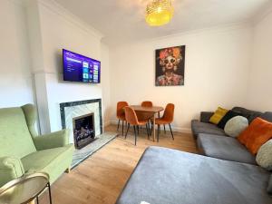 a living room with a couch and a table at Entire 5 Bed New Home - Southampton Centre - 4BDRM in Southampton